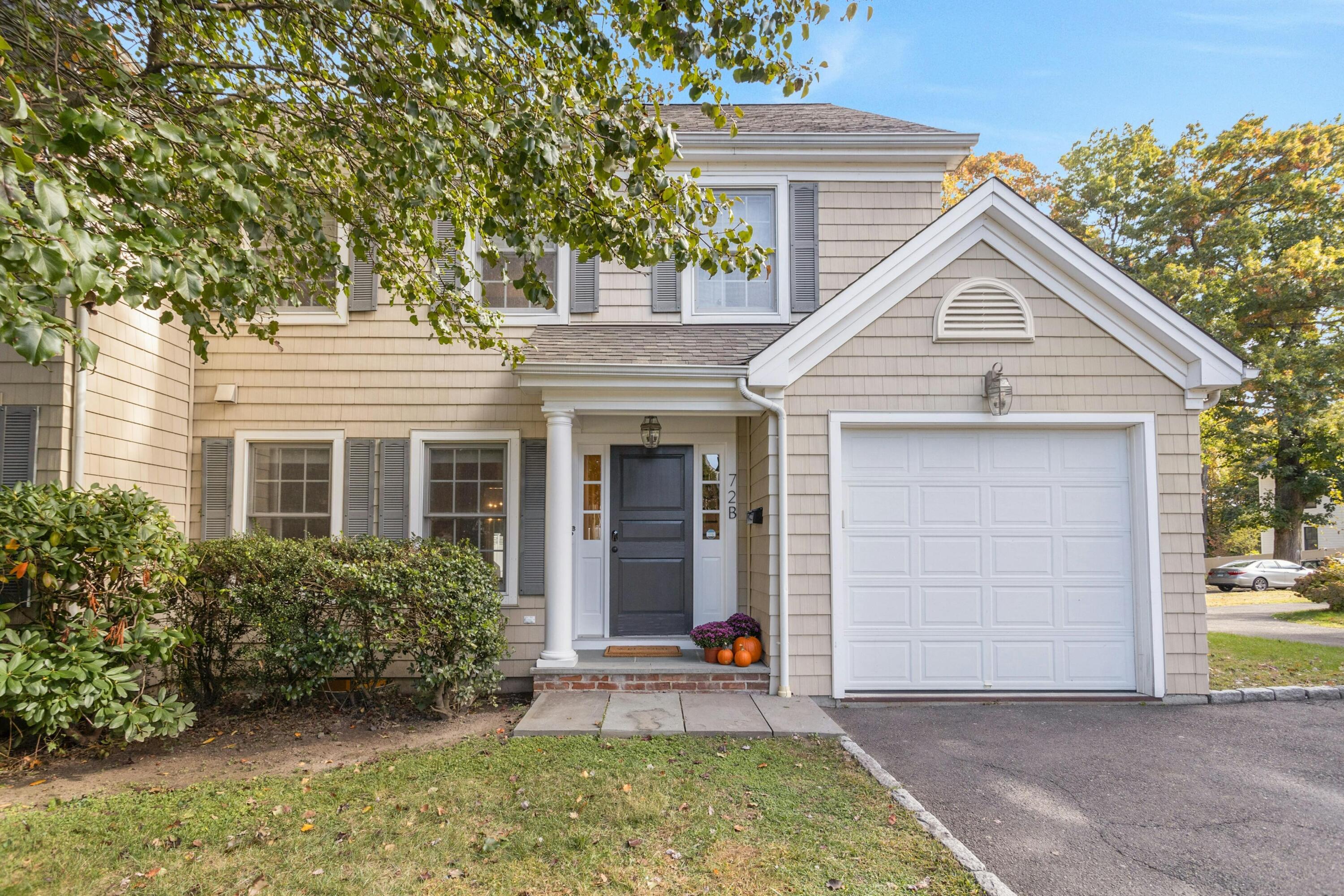 72 Summer Street, Unit B New Canaan, CT 06840 - Photo 1 of 27 front view of a house with a yard