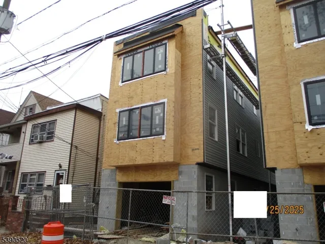 a front view of a building with many windows
