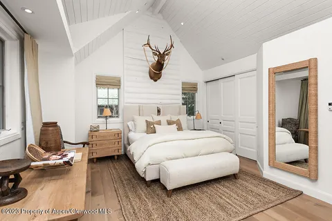 a bedroom with bed and window