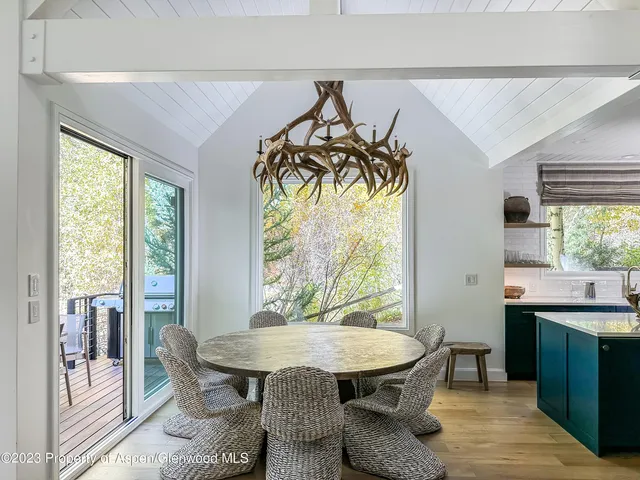 a view of a dining room with furniture window and outside view