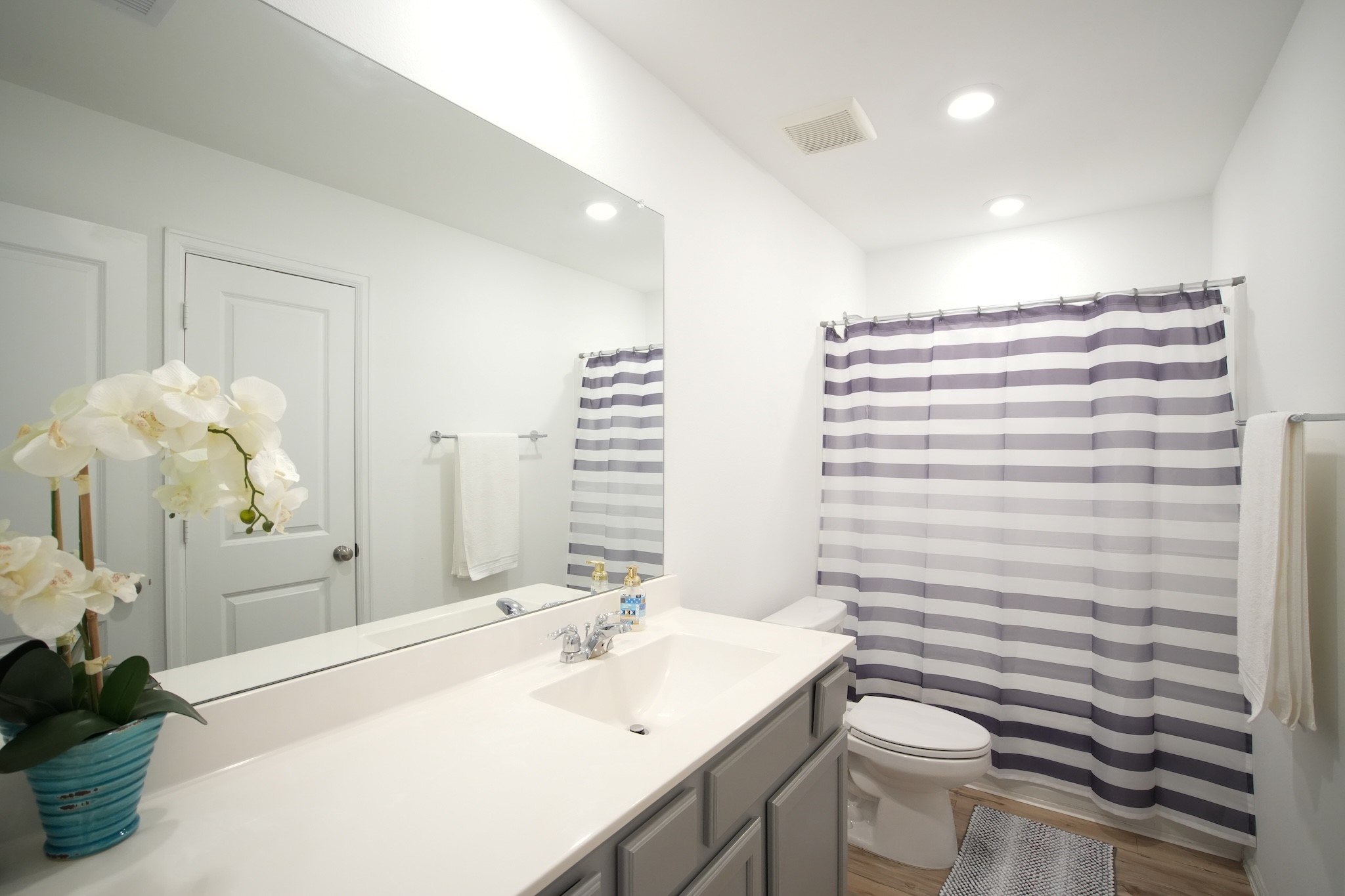 22691 Malvicino Drive New Caney, TX 77357 - Photo 11 of 12 a bathroom with a sink a toilet and shower