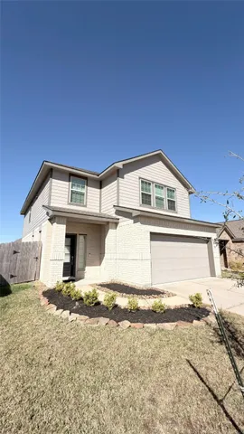 a view of a house with a house in the background