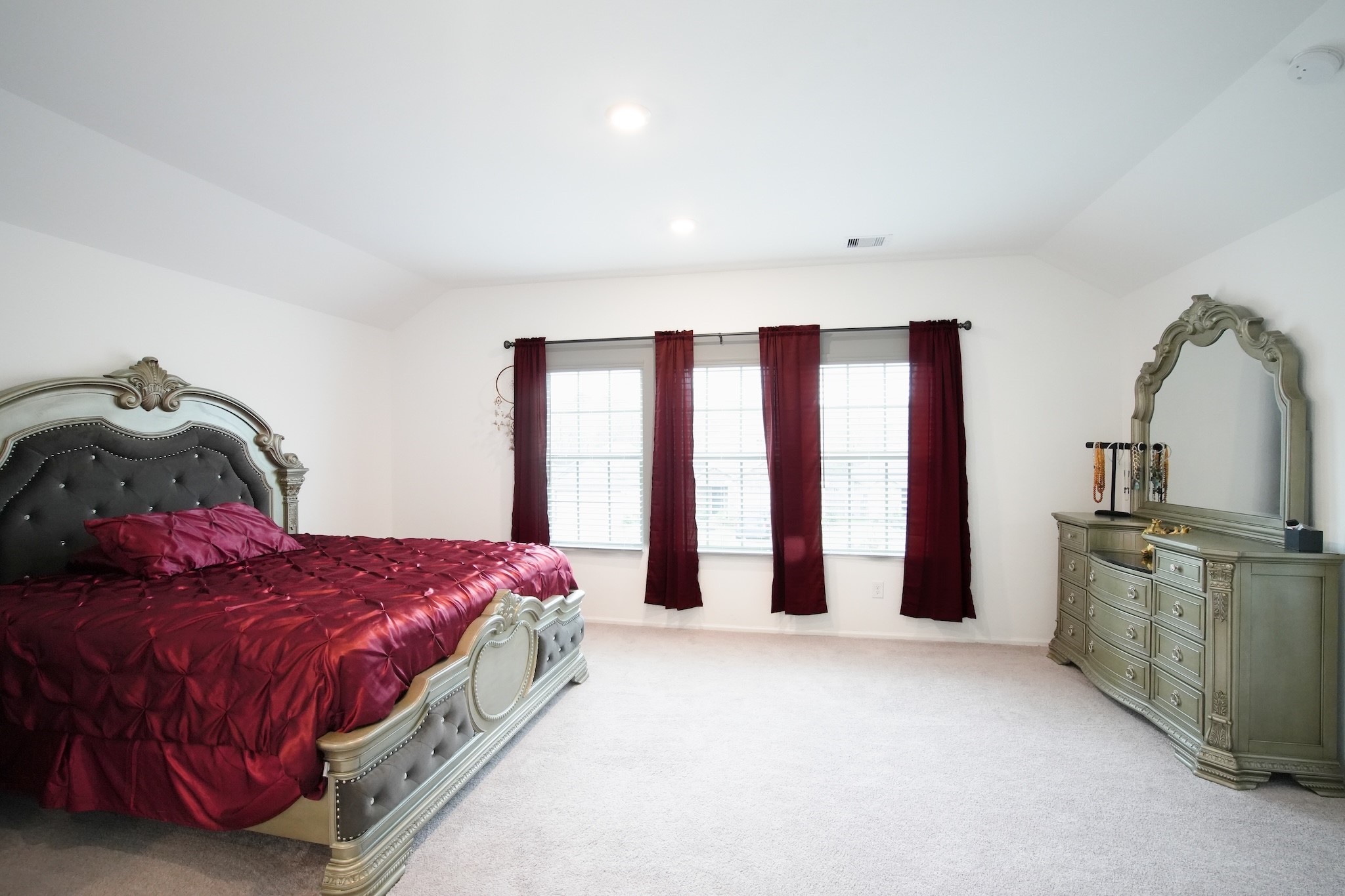 22691 Malvicino Drive New Caney, TX 77357 - Photo 6 of 12 a spacious bedroom with a bed and window