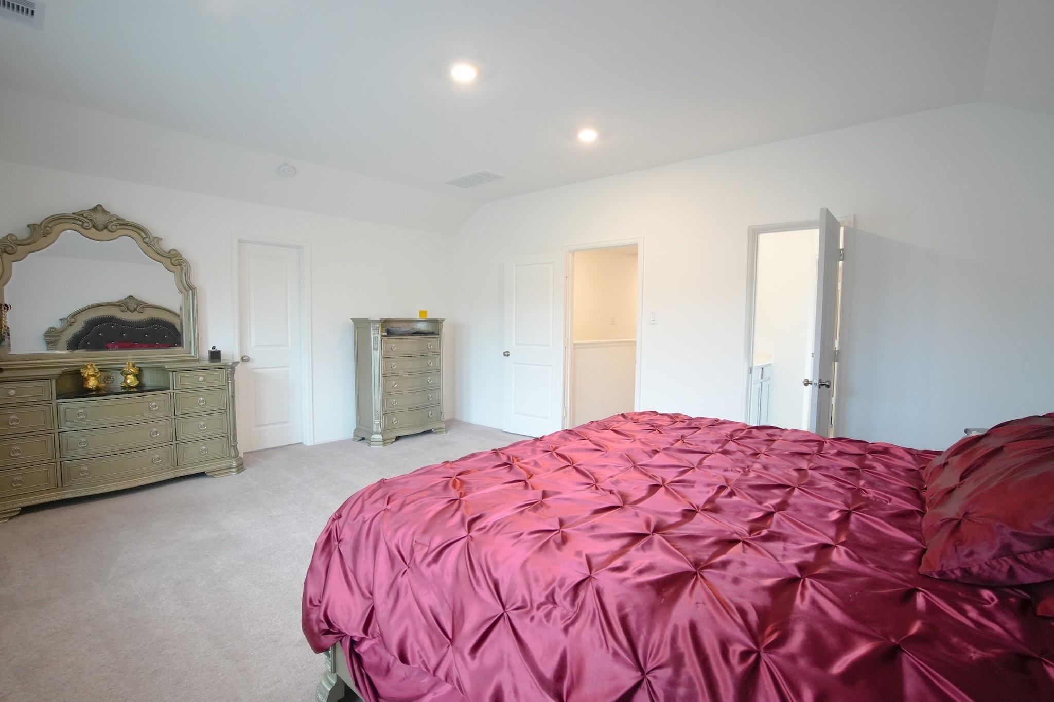 22691 Malvicino Drive New Caney, TX 77357 - Photo 7 of 12 a bedroom with a bed and a dresser