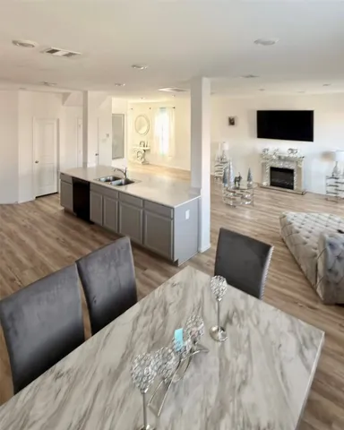 a large bedroom with a large bed and a flat screen tv