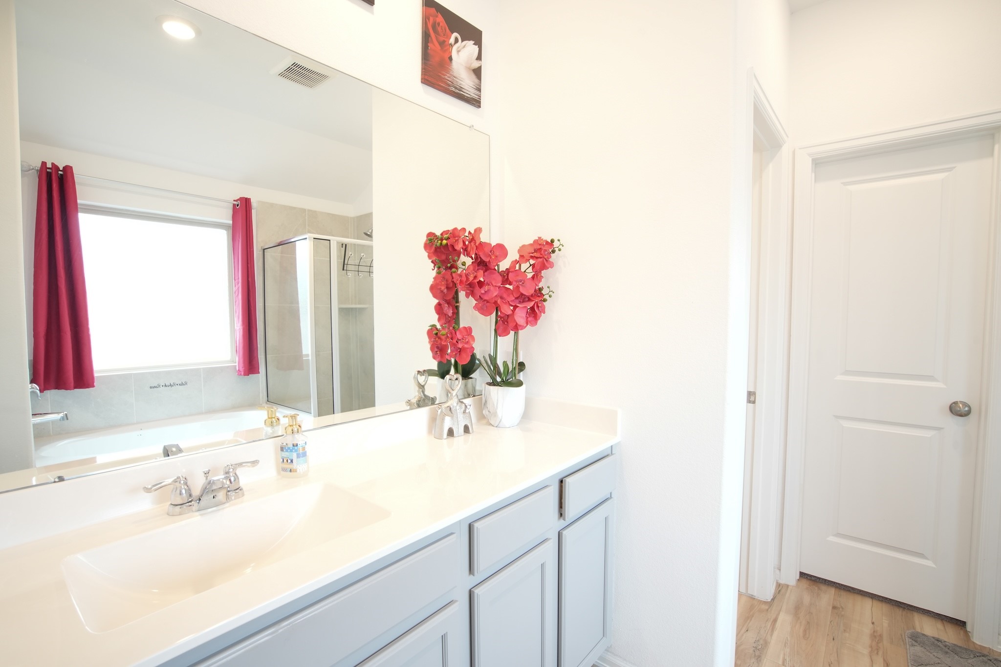 22691 Malvicino Drive New Caney, TX 77357 - Photo 9 of 12 a bathroom with a sink vanity and a mirror
