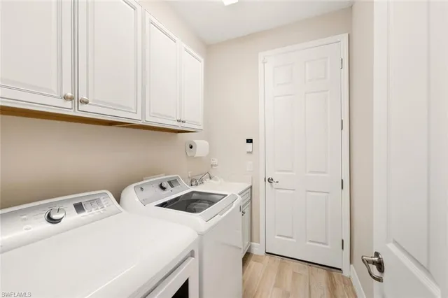 a view of a backyard with table and chairs potted plants and palm trees