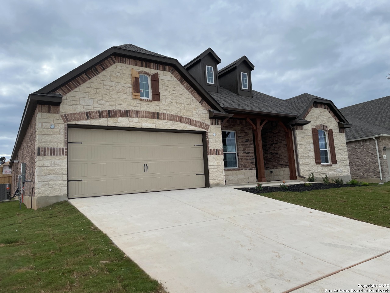 910 Harmisch Lane San Antonio, TX 78260 - Photo 1 of 1 a front view of a house with a yard
