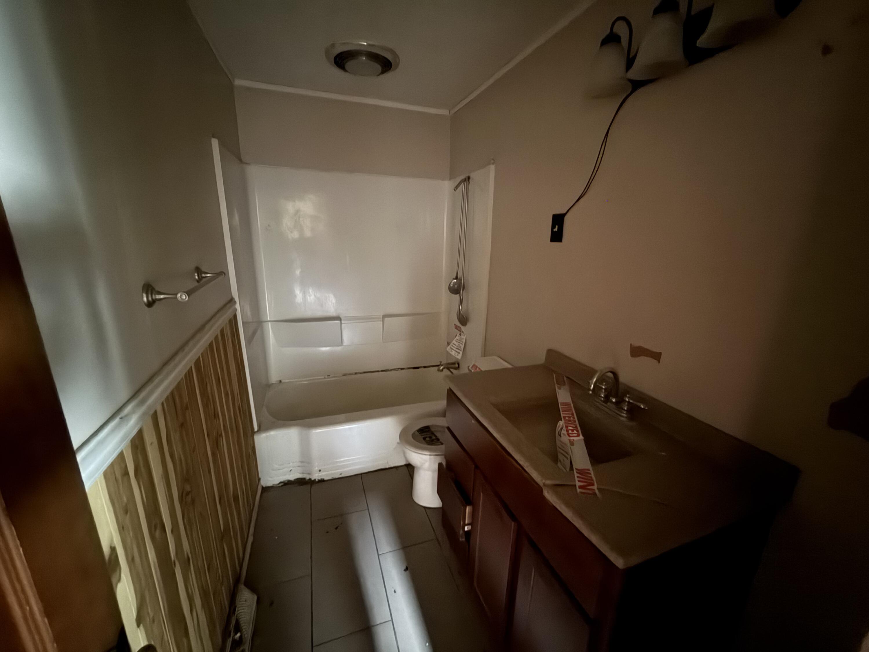 118 West Spring Street Winamac, IN 46996 - Photo 6 of 11 a bathroom with a sink and mirror