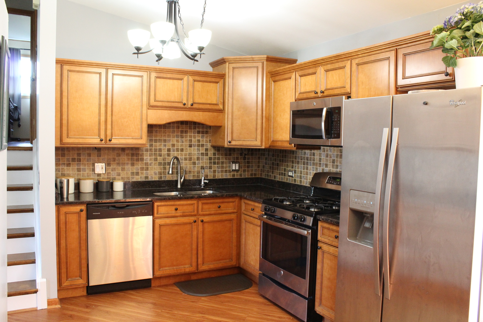 508 Northgate Road Lindenhurst, IL 60046 - Photo 4 of 27 a kitchen with stainless steel appliances a refrigerator sink and cabinets