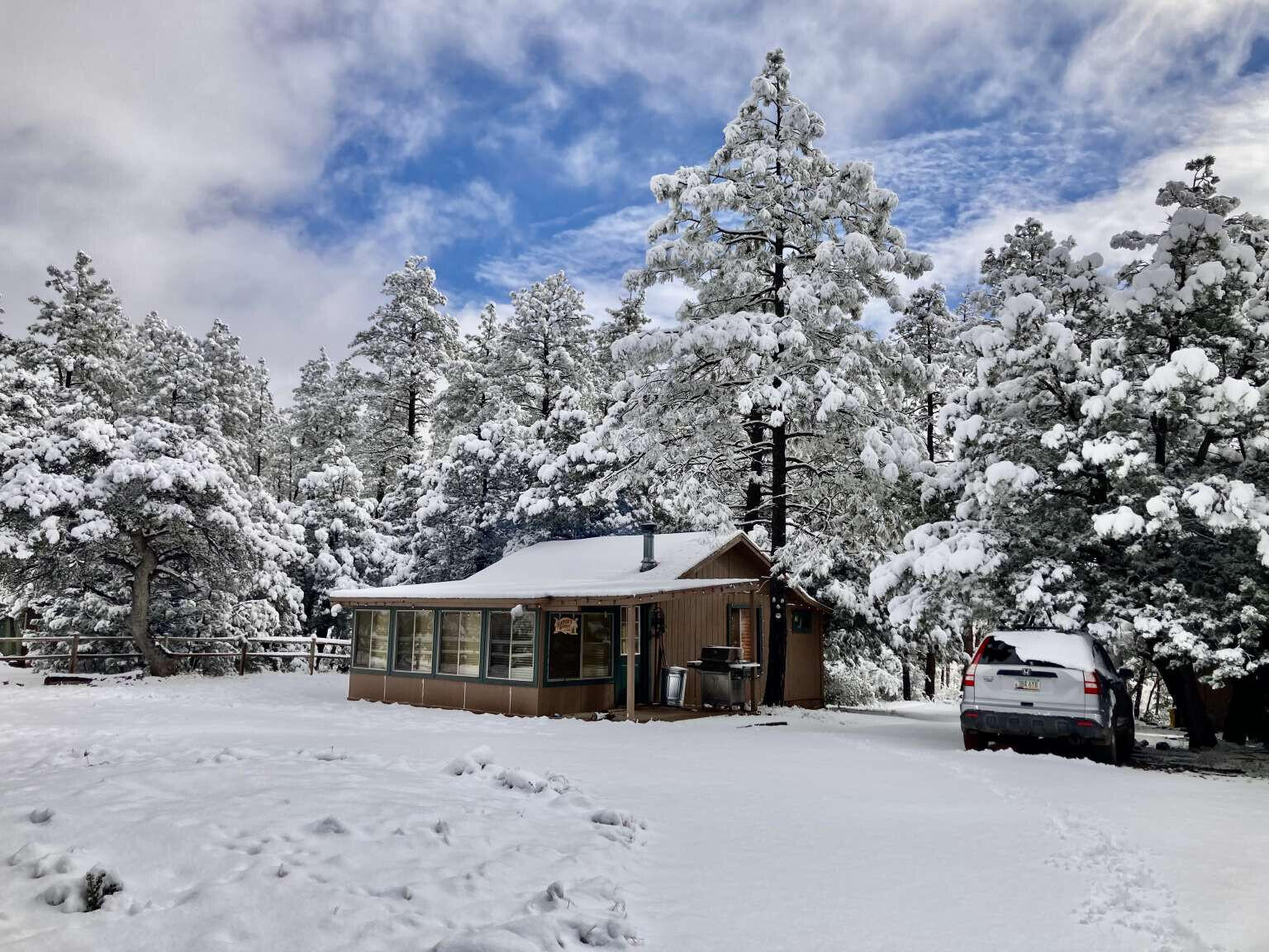 167 South Ranch Lane Payson, AZ 85541 - Photo 17 of 40 a front view of a house with a yard covered in snow