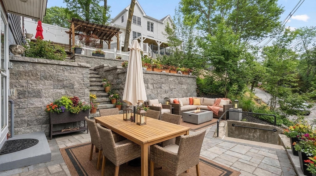 2 Deane Avenue, Unit A Winthrop, MA 02152 - Photo 13 of 18 a backyard of a house with seating space