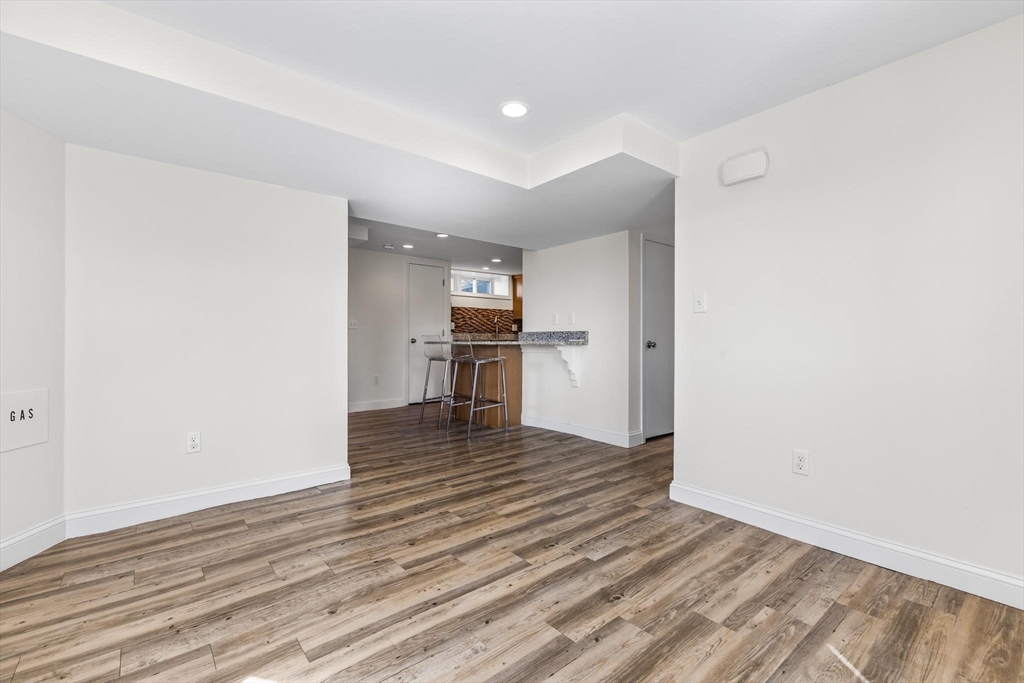 2 Deane Avenue, Unit A Winthrop, MA 02152 - Photo 7 of 18 a view of empty room with wooden floor