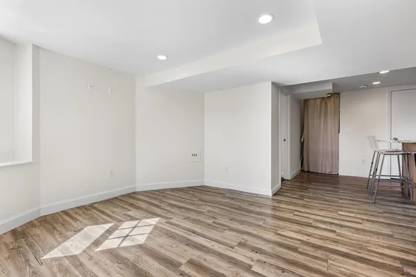 a view of a livingroom with wooden floor