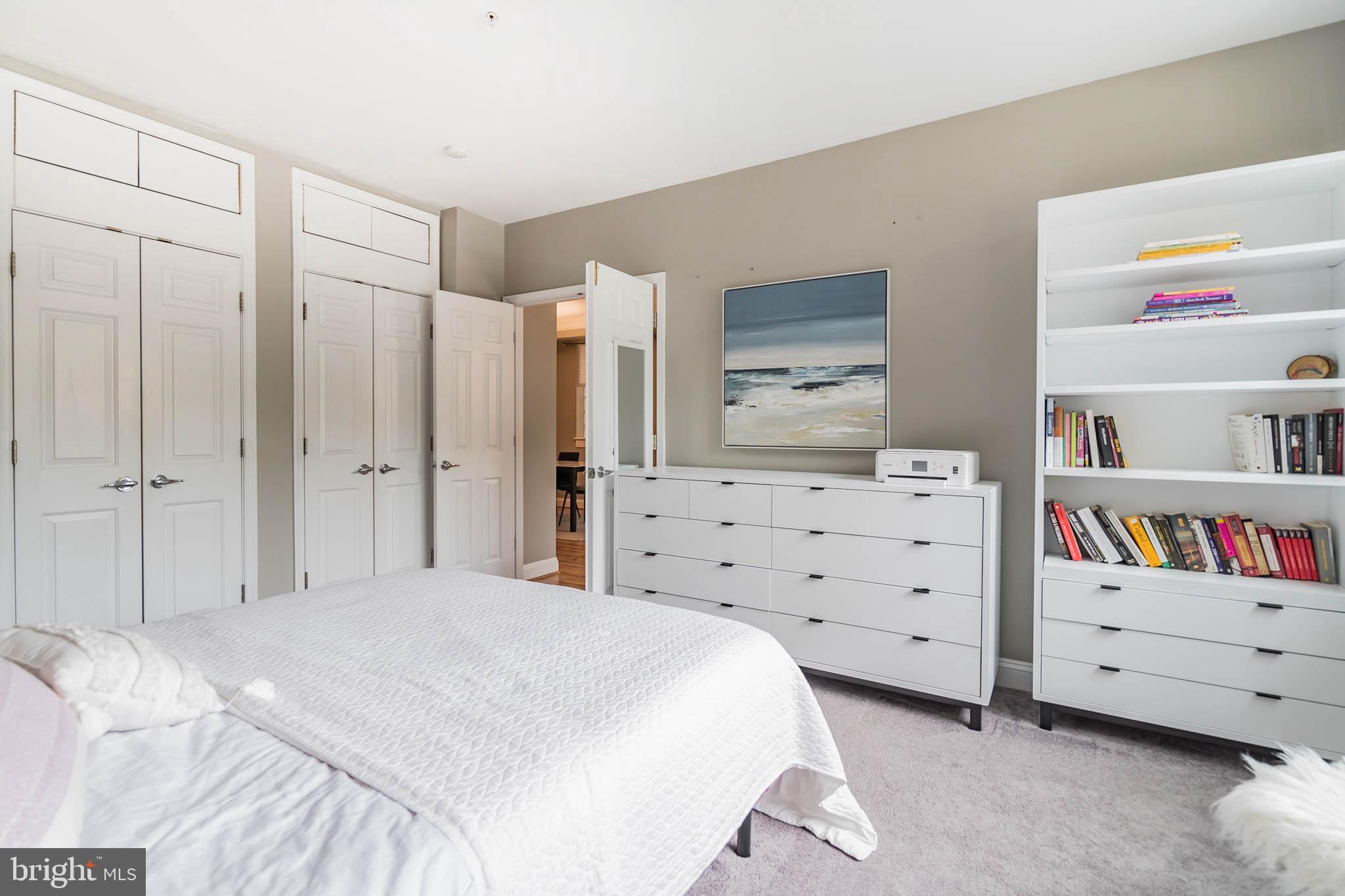 2801 Connecticut Avenue Northwest, Unit 16 Washington, DC 20008 - Photo 7 of 17 a bedroom with a bed and a dresser