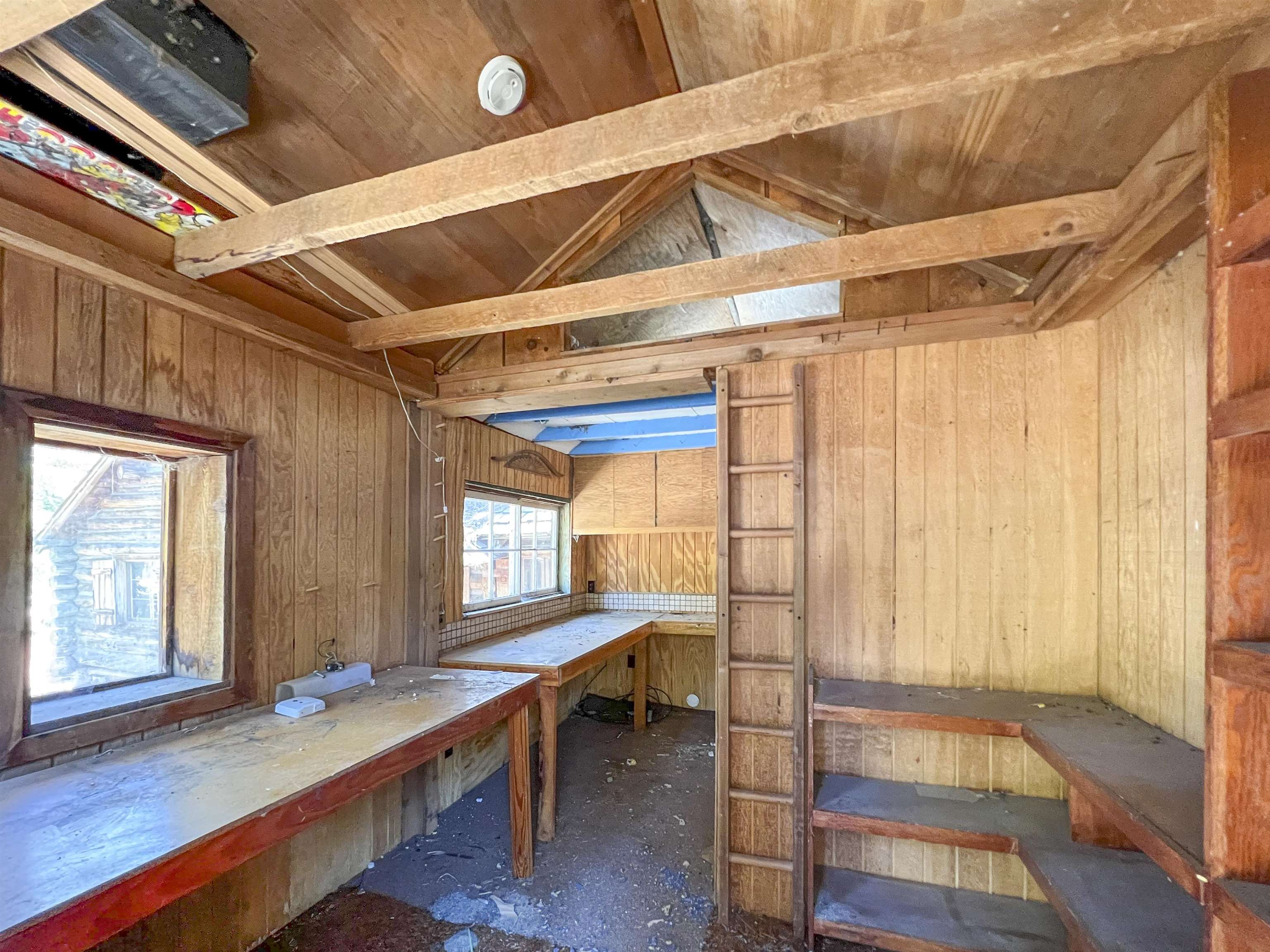 40 Gull Street Mammoth Lakes, CA 93546 - Photo 18 of 44 a room with lot of large windows and furniture