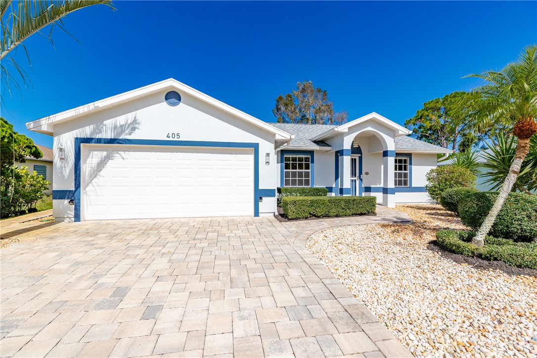 405 Columbus Street Sebastian, FL 32958 - Photo 1 of 36 a view of a house with a yard