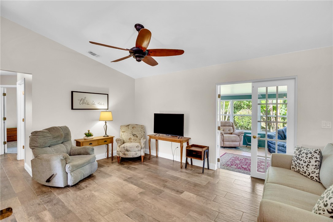 405 Columbus Street Sebastian, FL 32958 - Photo 11 of 36 a living room with furniture and a flat screen tv