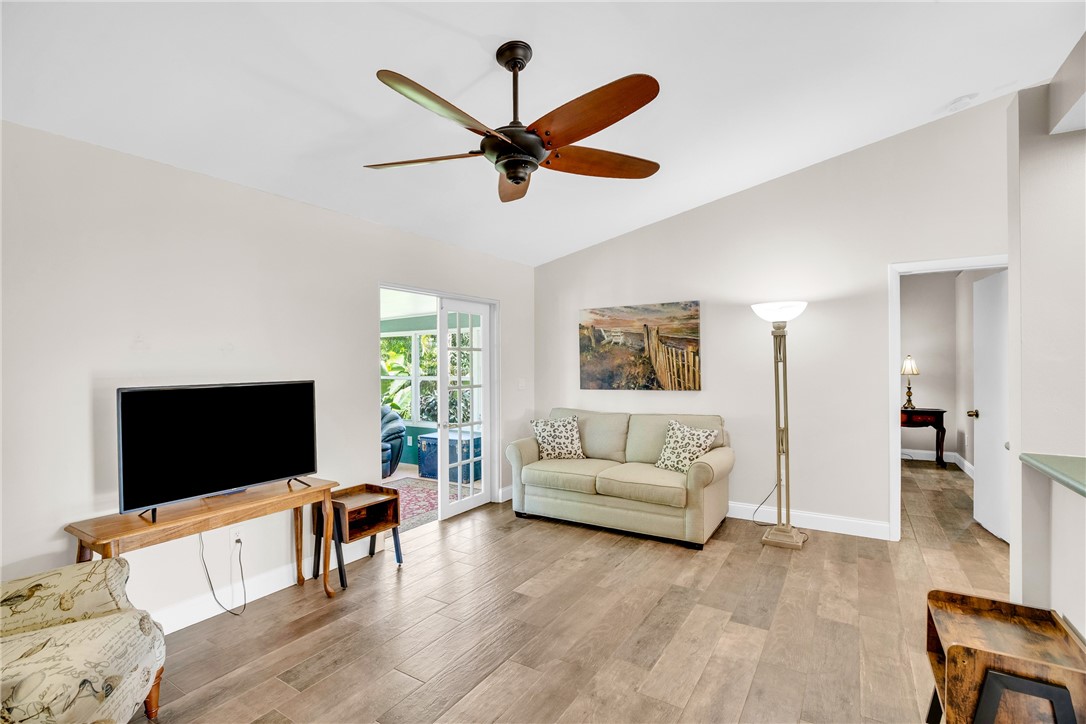 405 Columbus Street Sebastian, FL 32958 - Photo 12 of 36 a living room with furniture and a flat screen tv