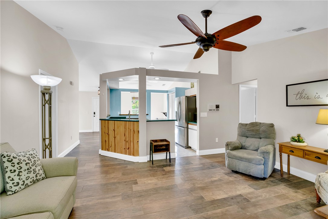 405 Columbus Street Sebastian, FL 32958 - Photo 13 of 36 a living room with furniture and a ceiling fan