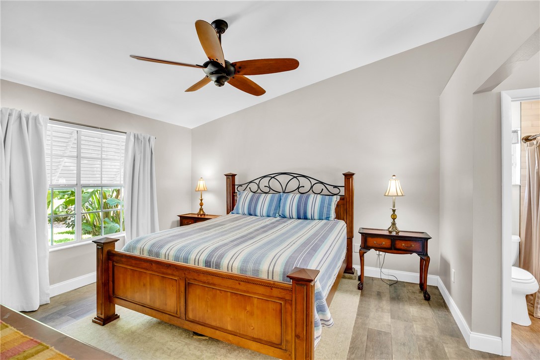 405 Columbus Street Sebastian, FL 32958 - Photo 14 of 36 a bedroom with a bed and a window