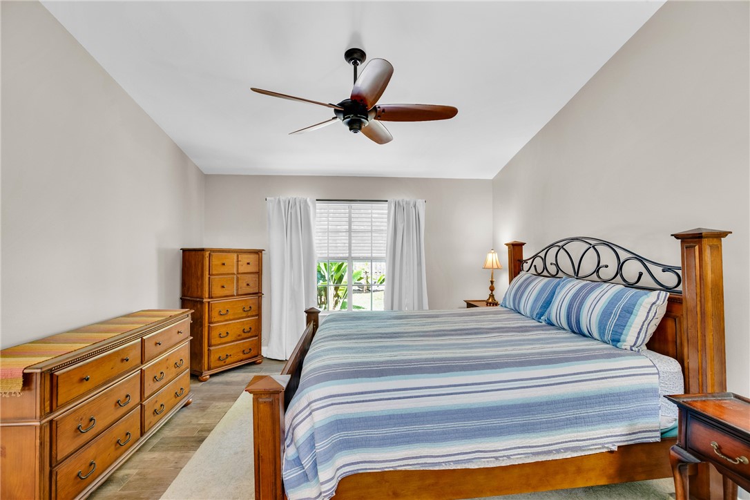 405 Columbus Street Sebastian, FL 32958 - Photo 15 of 36 a bedroom with a bed and a window