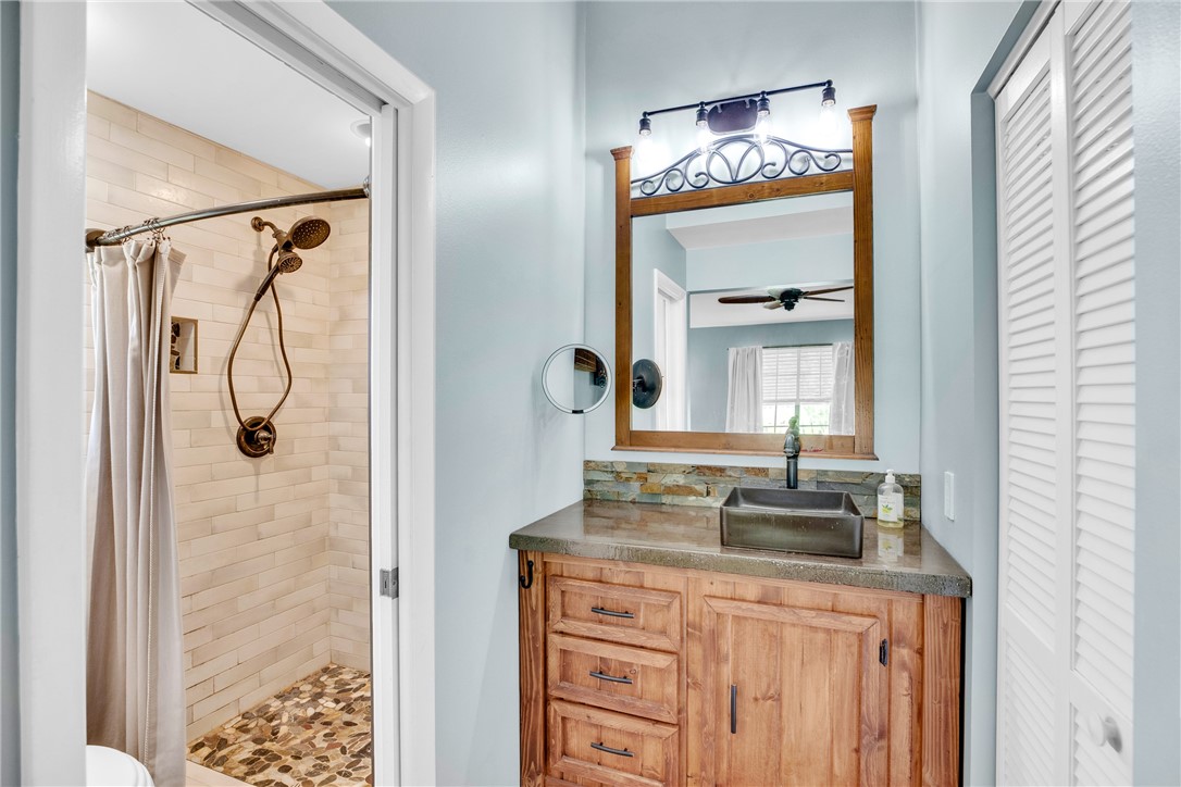 405 Columbus Street Sebastian, FL 32958 - Photo 16 of 36 a bathroom with a granite countertop sink and a mirror