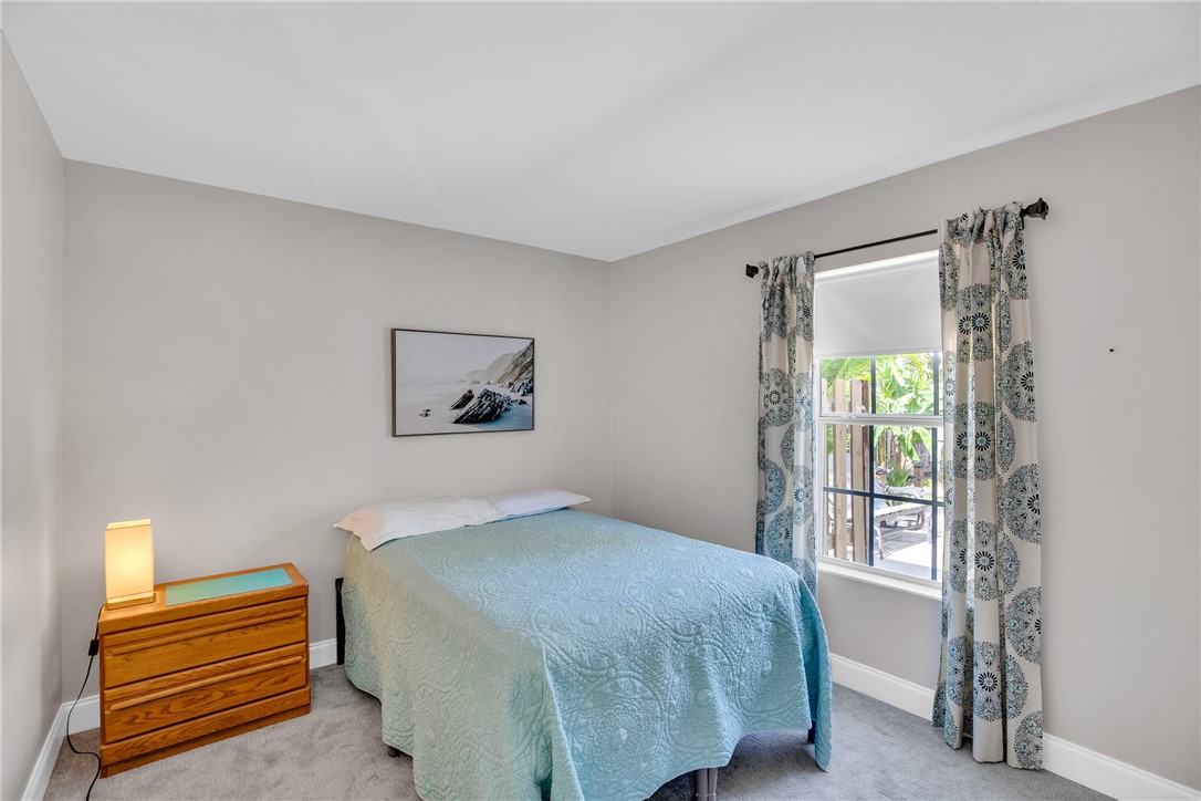 405 Columbus Street Sebastian, FL 32958 - Photo 20 of 36 a bedroom with a bed and a window