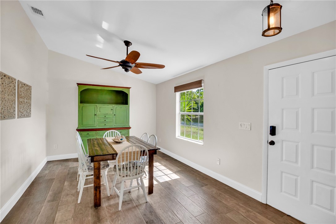 405 Columbus Street Sebastian, FL 32958 - Photo 2 of 36 a workspace with furniture and a window