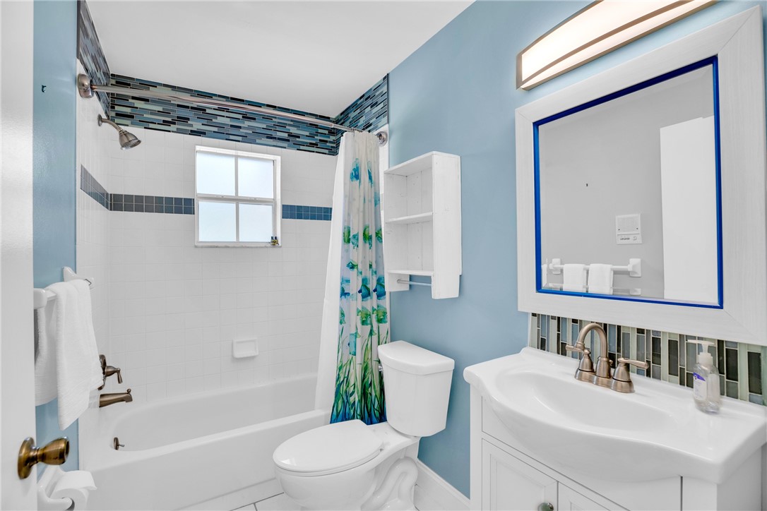 405 Columbus Street Sebastian, FL 32958 - Photo 22 of 36 a bathroom with a sink toilet and shower