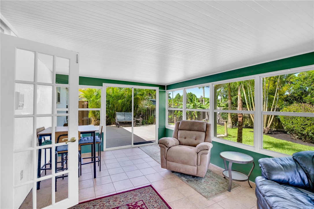405 Columbus Street Sebastian, FL 32958 - Photo 25 of 36 a living room with furniture and a large window