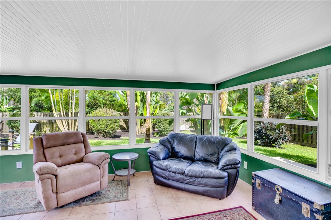 405 Columbus Street Sebastian, FL 32958 - Photo 26 of 36 a living room with furniture and a large window