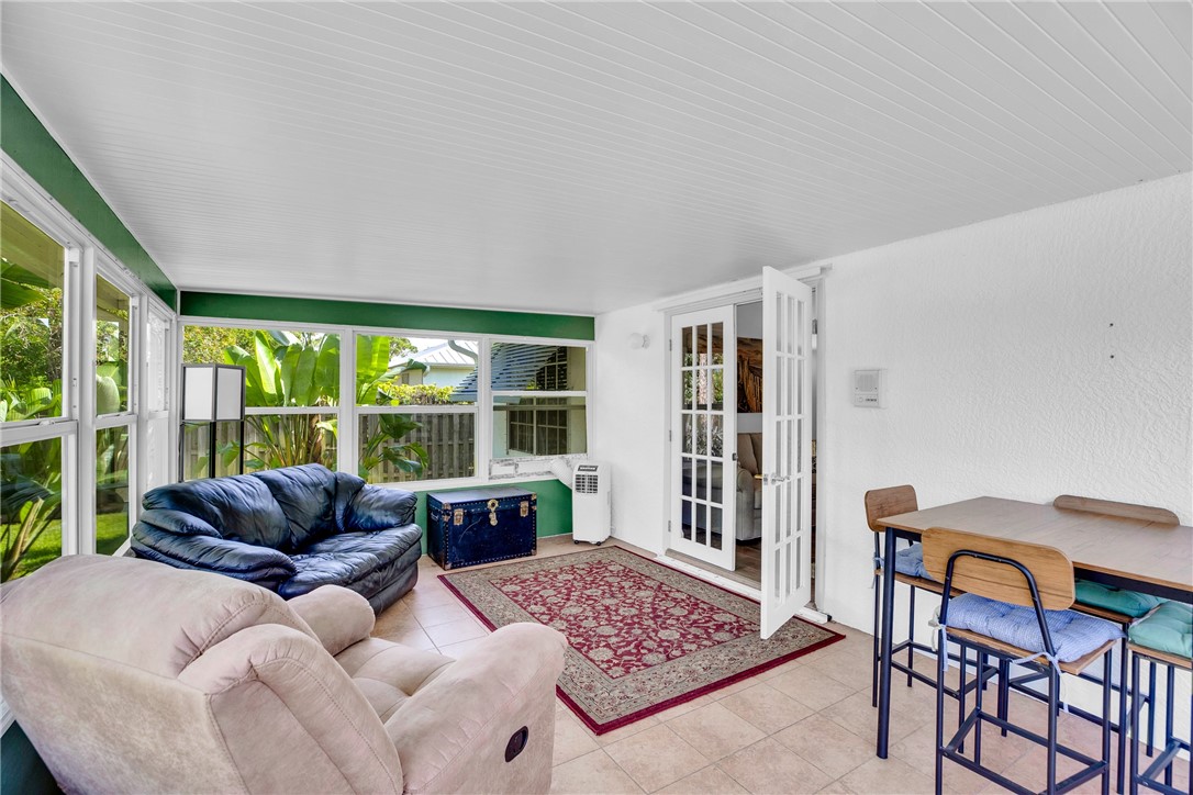 405 Columbus Street Sebastian, FL 32958 - Photo 27 of 36 a living room with furniture and a large window