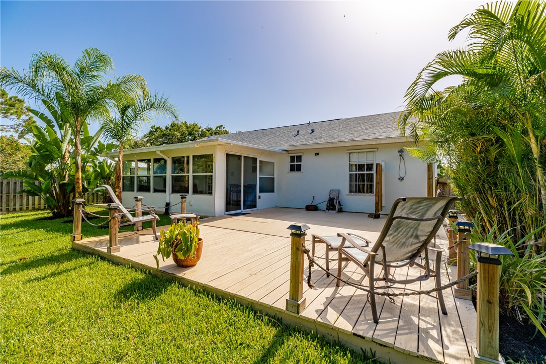 405 Columbus Street Sebastian, FL 32958 - Photo 31 of 36 a view of a house with backyard and sitting area