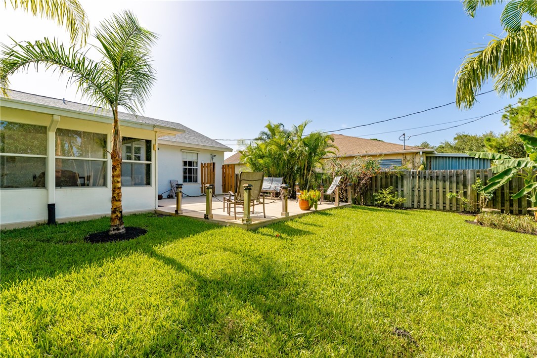 405 Columbus Street Sebastian, FL 32958 - Photo 33 of 36 a view of an house with backyard and a tree