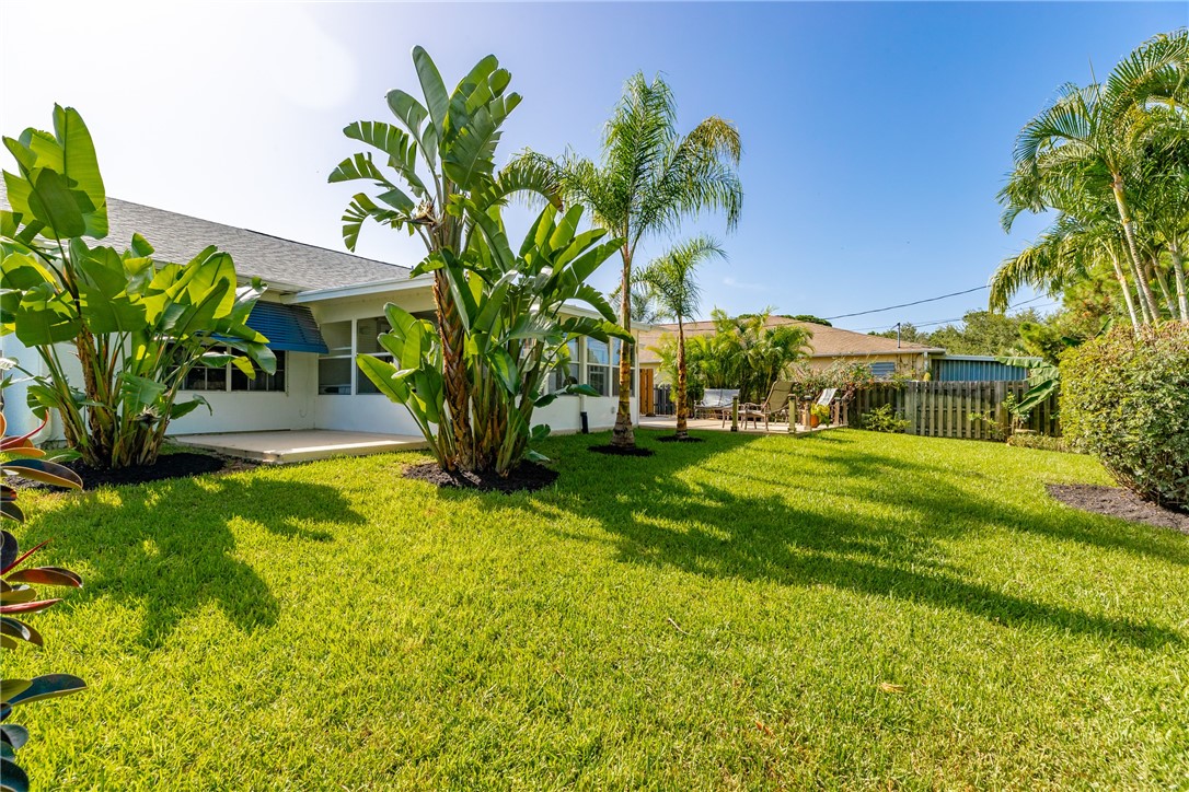 405 Columbus Street Sebastian, FL 32958 - Photo 34 of 36 a view of a yard with palm trees