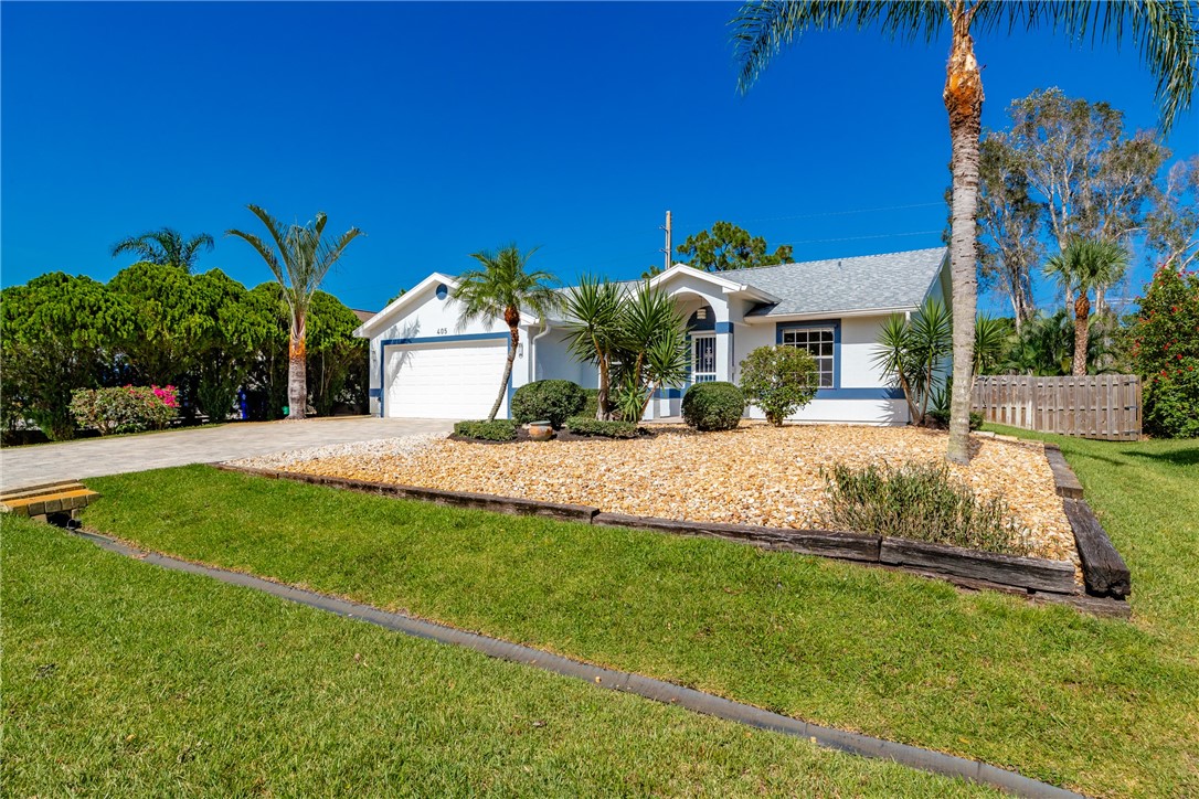 405 Columbus Street Sebastian, FL 32958 - Photo 36 of 36 a front view of a house with a yard