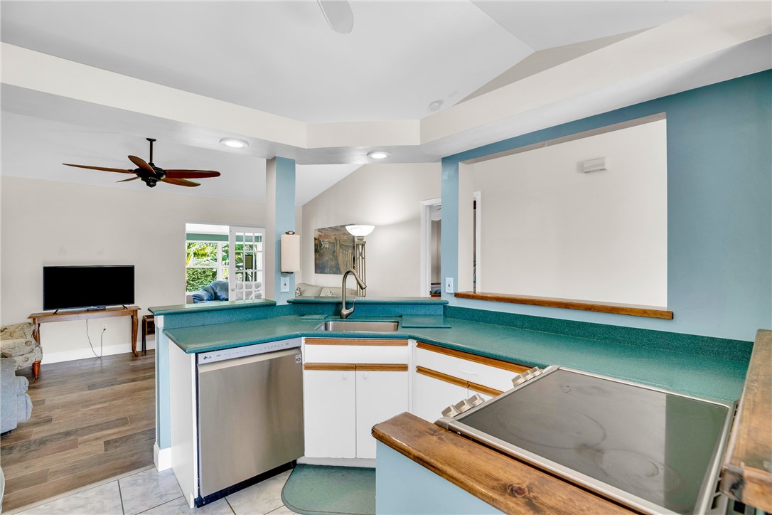 405 Columbus Street Sebastian, FL 32958 - Photo 7 of 36 a kitchen with a sink and a stove top oven