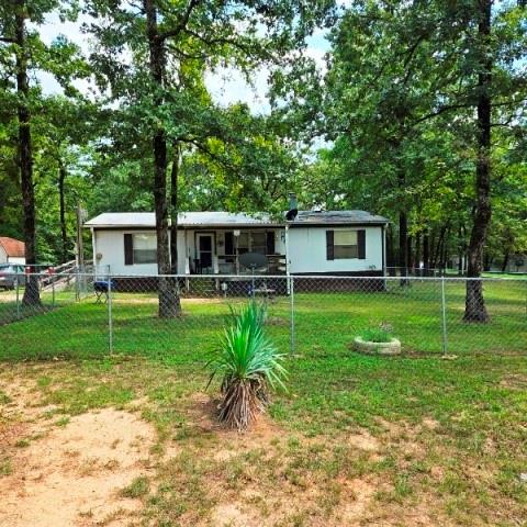 108 Elm Street Mabank, TX 75156 - Photo 1 of 22 a front view of a house with a yard table and chairs