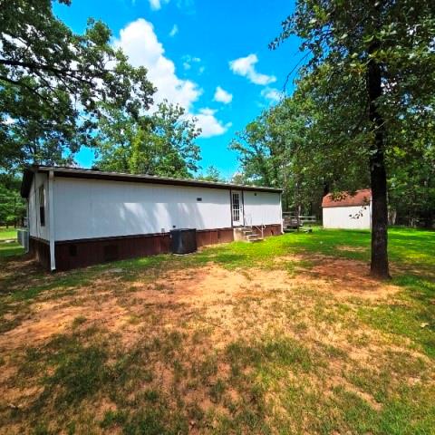 108 Elm Street Mabank, TX 75156 - Photo 7 of 22 a house view with a swimming pool