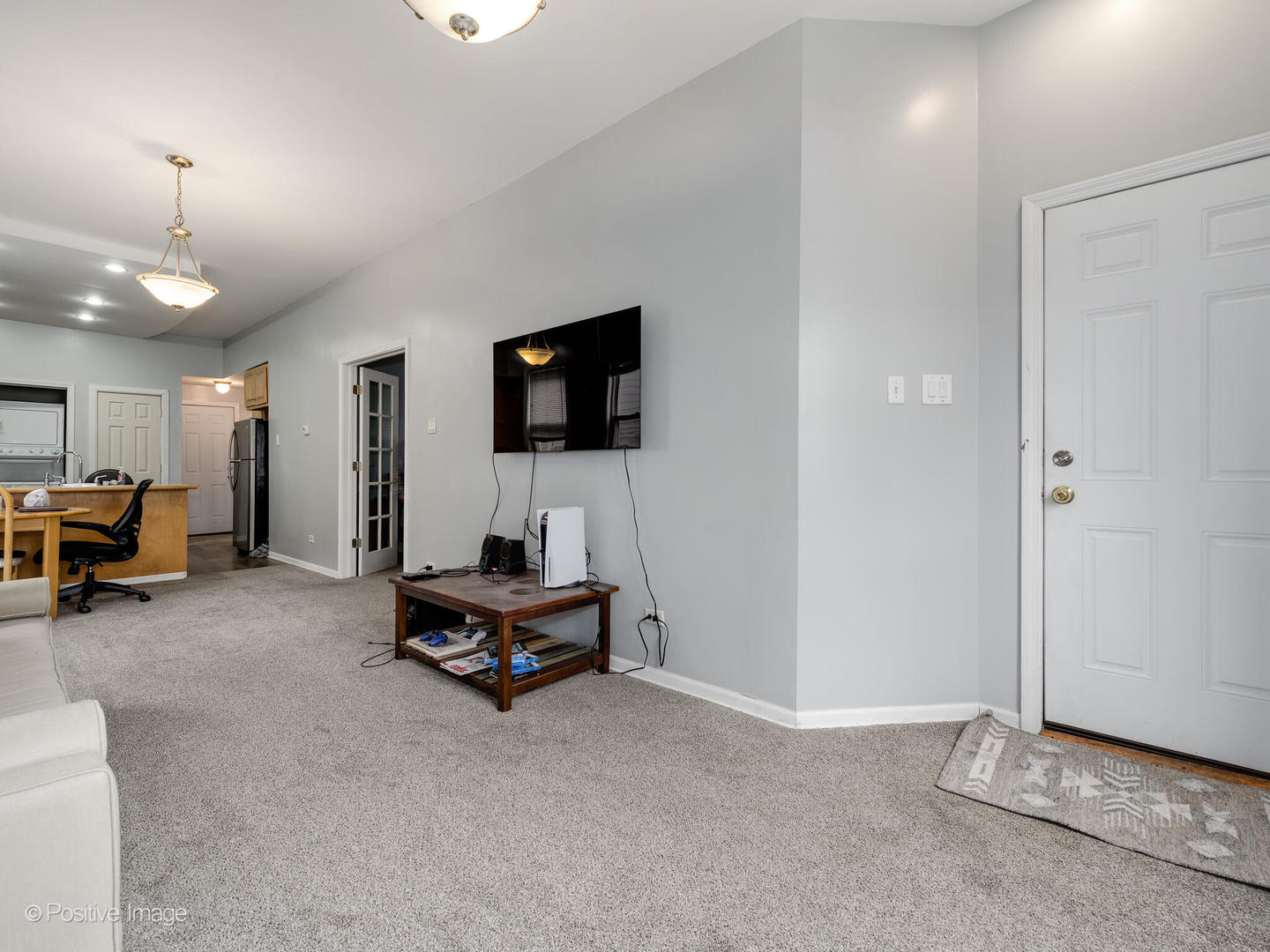2620 West Homer Street Chicago, IL 60647 - Photo 11 of 31 a living room with furniture a flat screen tv and a window