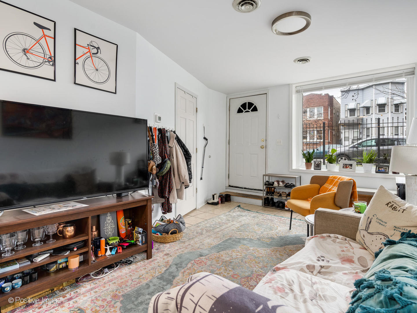 2620 West Homer Street Chicago, IL 60647 - Photo 17 of 31 a bedroom with furniture and a large window