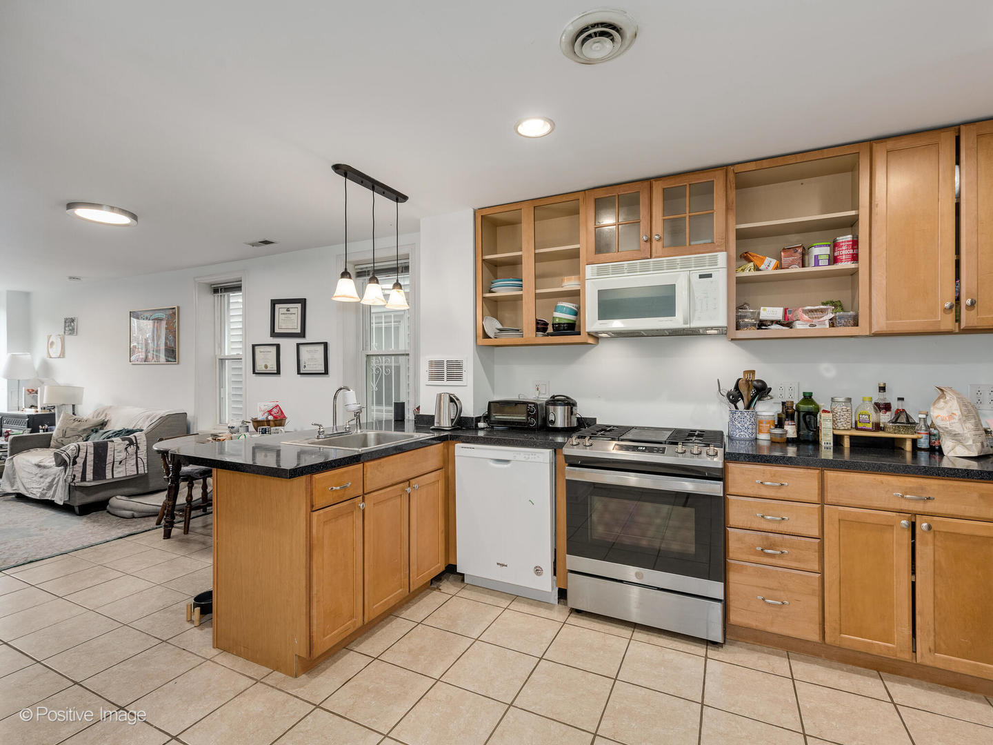 2620 West Homer Street Chicago, IL 60647 - Photo 20 of 31 a kitchen with stainless steel appliances granite countertop a stove and cabinets