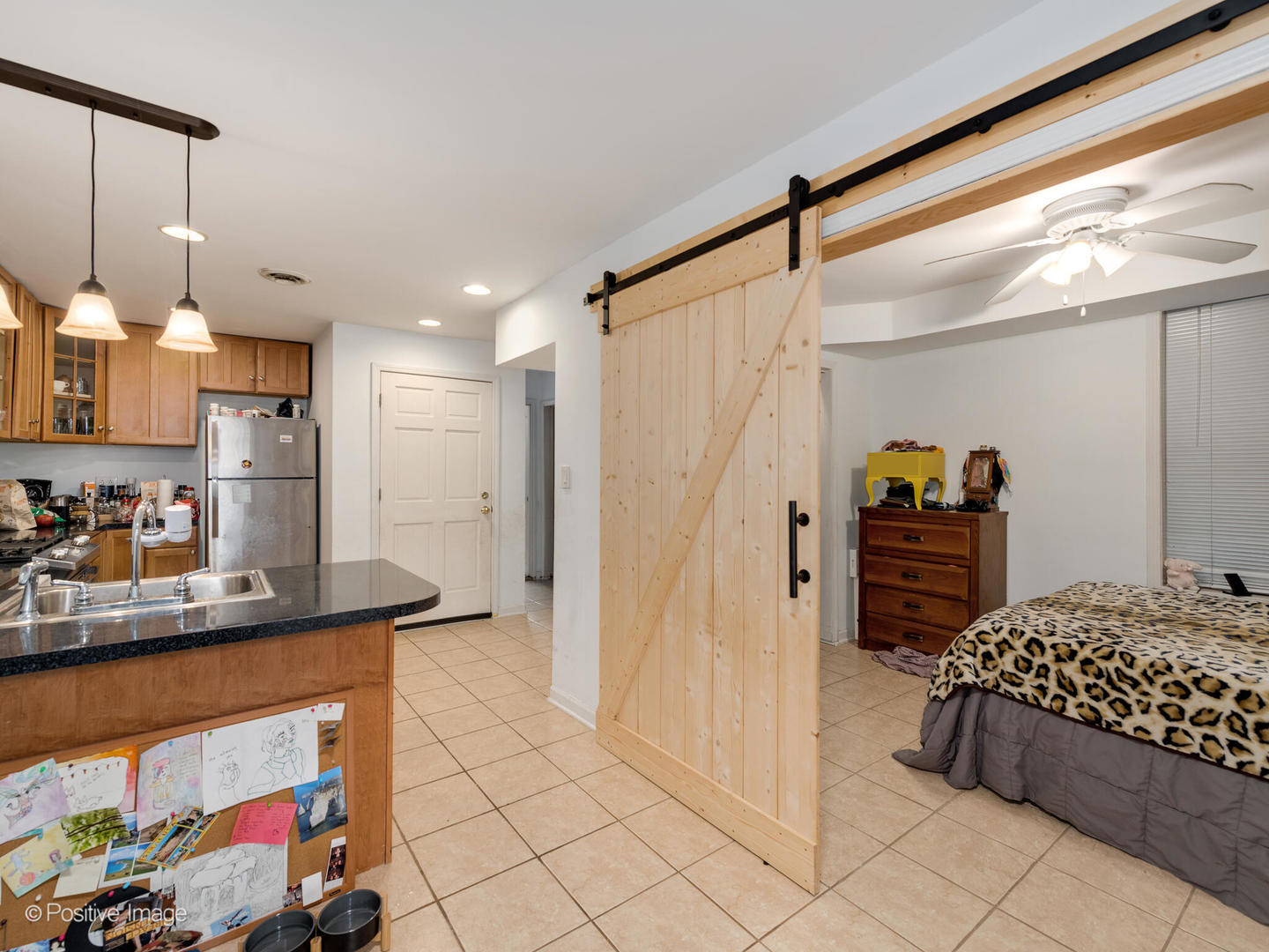 2620 West Homer Street Chicago, IL 60647 - Photo 21 of 31 a kitchen with stainless steel appliances kitchen island granite countertop a refrigerator and a sink