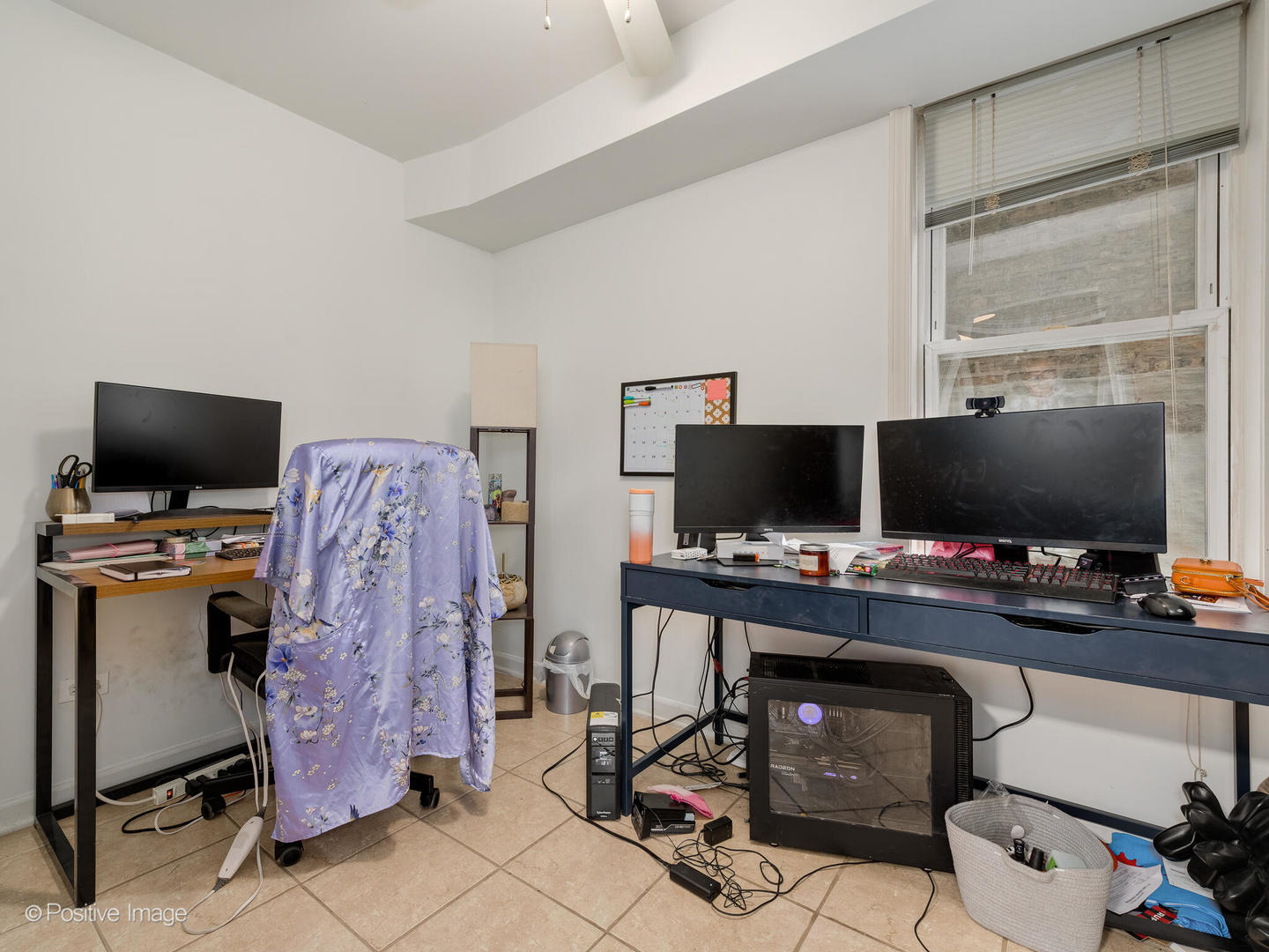 2620 West Homer Street Chicago, IL 60647 - Photo 23 of 31 a view of a workspace with furniture and a flat screen tv