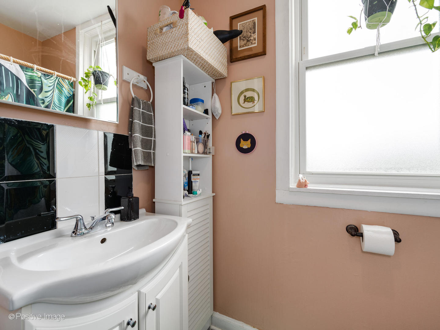 2620 West Homer Street Chicago, IL 60647 - Photo 9 of 31 a bathroom with a sink and a mirror