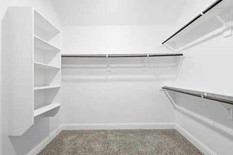 a view of an empty walk in closet