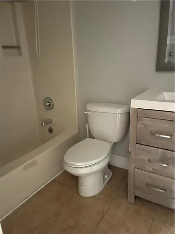 a bathroom with a toilet and a bathtub