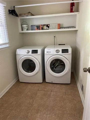 a utility room with dryer and washer