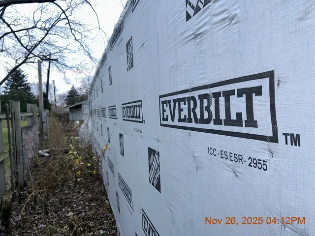 a view of a wooden house with a signage